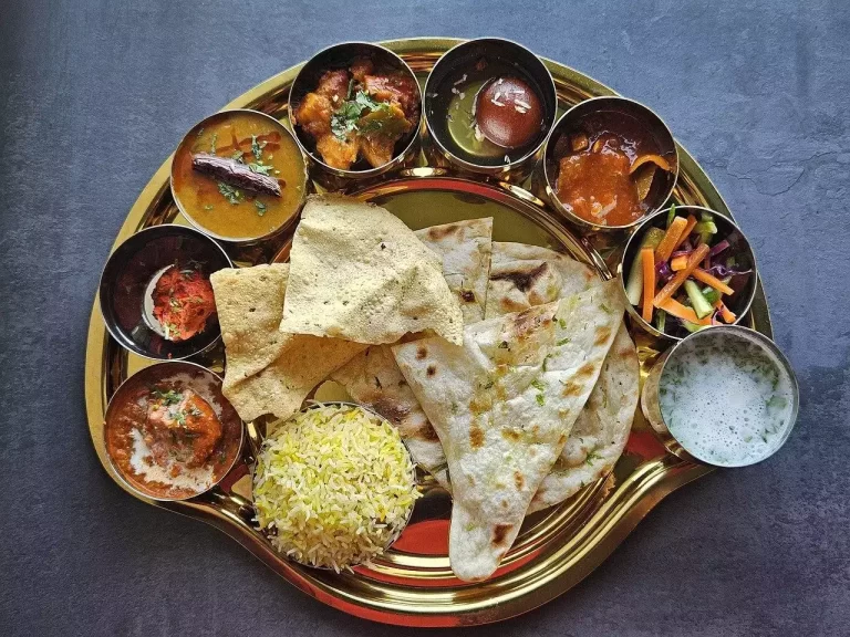 Rephrase the title:Rising tomato & pulse prices push up veg thali cost in January, but non-veg thali costs come down